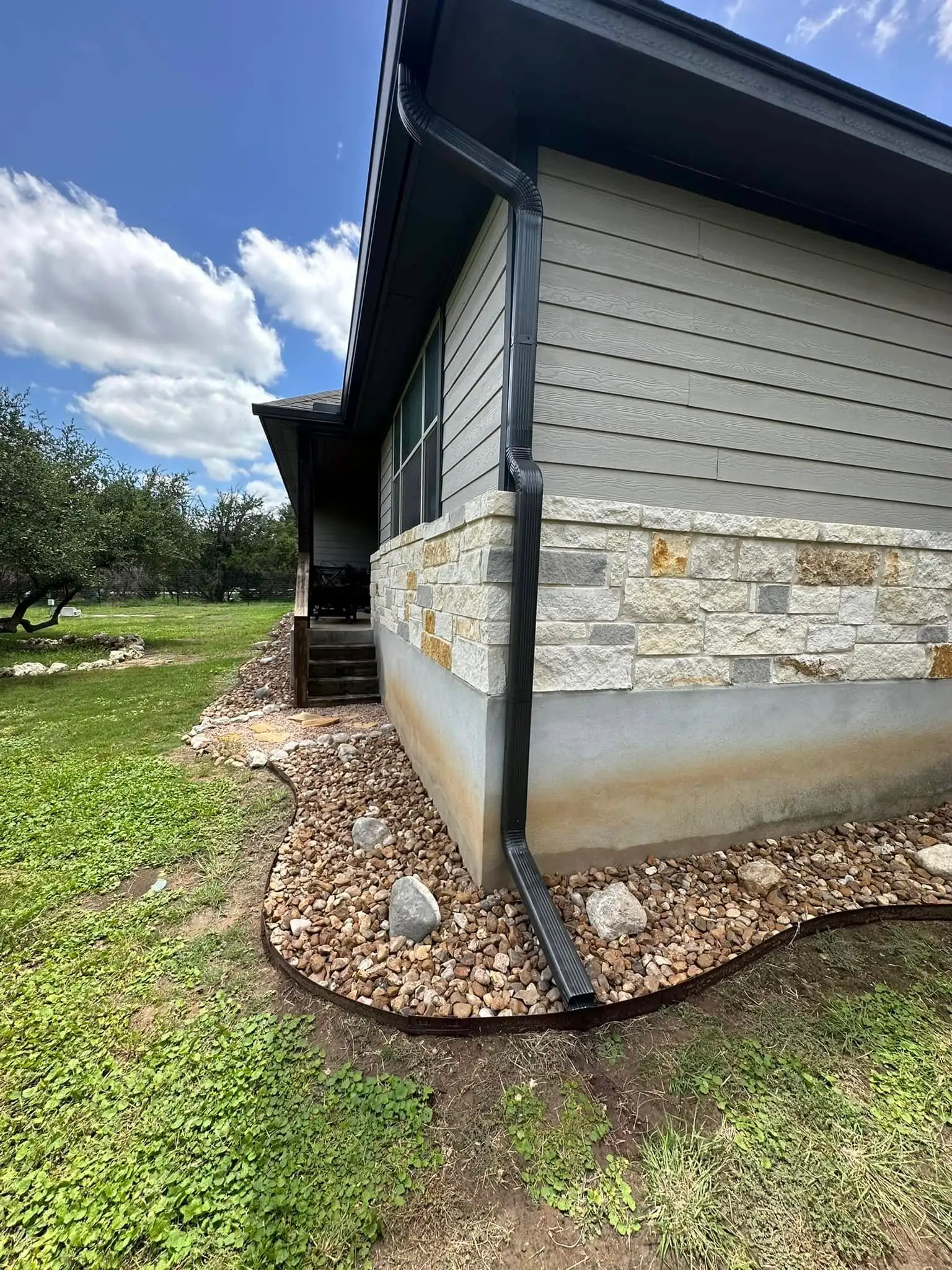 Completed gutter installation on a well-kept Texas home
